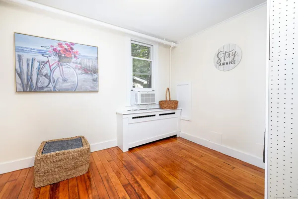 a room with furniture and wooden floor