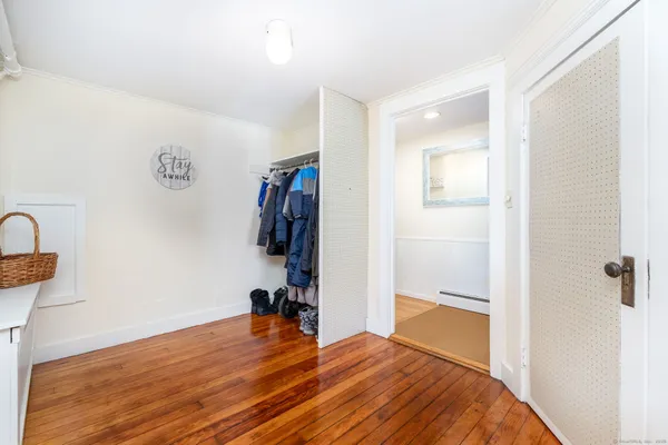 a bedroom with a bed and a table in it