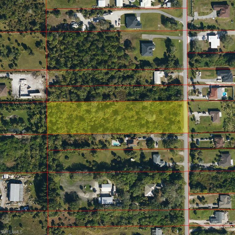 731 14th Street Northeast Naples, FL 34120 - Photo 1 of 1 a view of a lake with a building