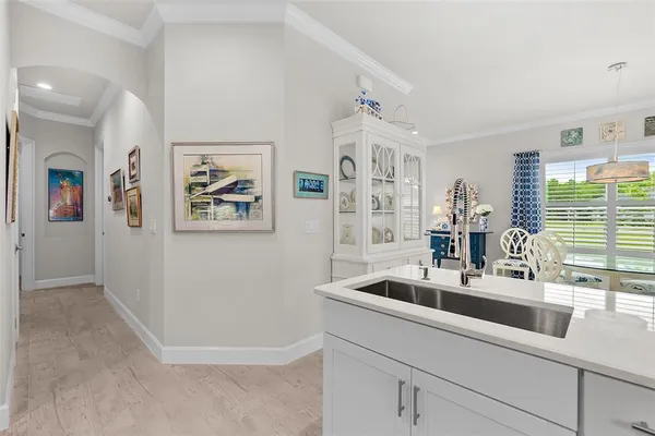 a kitchen with stainless steel appliances a stove microwave and refrigerator