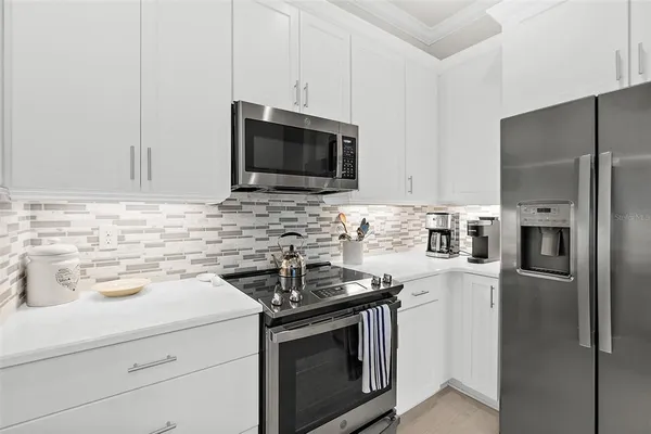 a living room with furniture and a chair