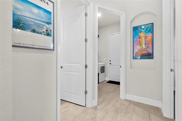 a bedroom with a bed and a mirror