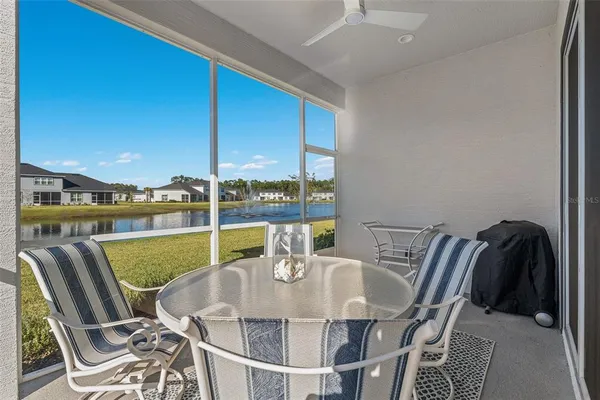 an aerial view of a house with a lake view