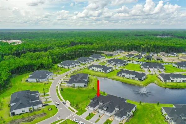 an aerial view of a house with a garden