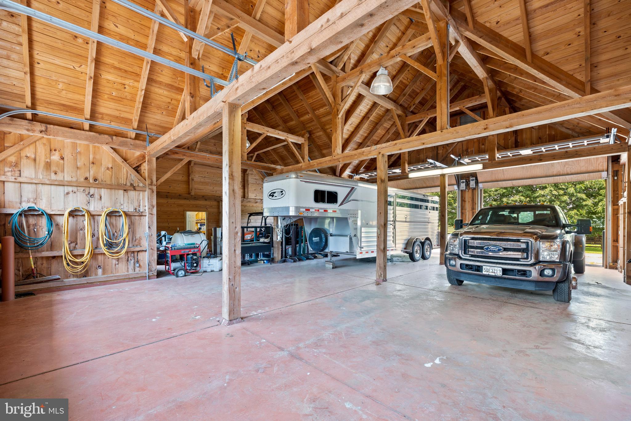 14111 Green Road Glyndon, MD 21136 - Photo 128 of 146 a view of a garage with wooden table and chairs