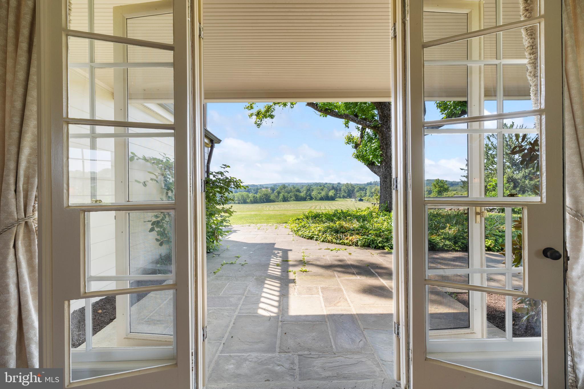 14111 Green Road Glyndon, MD 21136 - Photo 15 of 146 a view of a glass door with a yard from a window