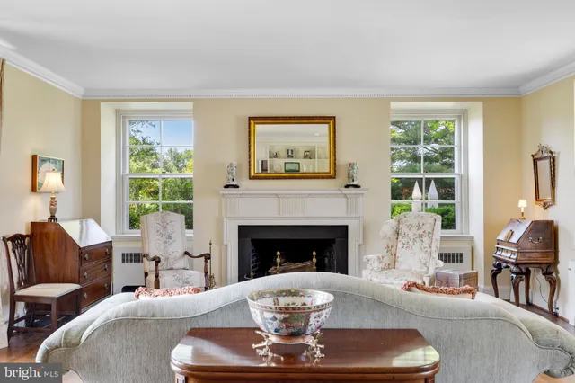 a view of a livingroom with furniture and a floor to ceiling window