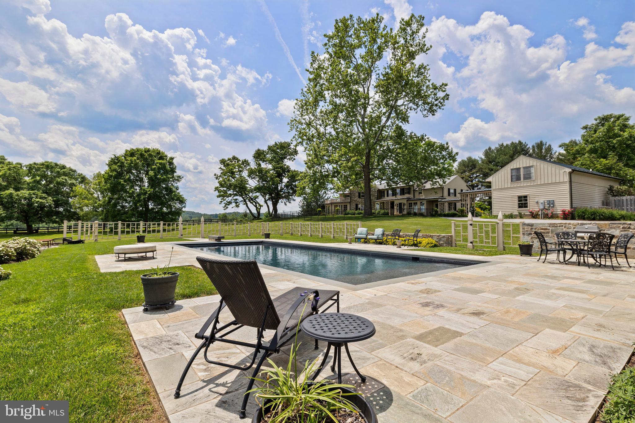14111 Green Road Glyndon, MD 21136 - Photo 99 of 146 a view of swimming pool with seating space and trees in the background