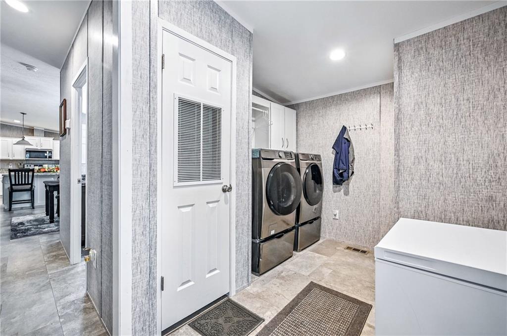 73 South Summit Road, Unit 503 Greenville, PA 16125 - Photo 23 of 36 a utility room with dryer and washer
