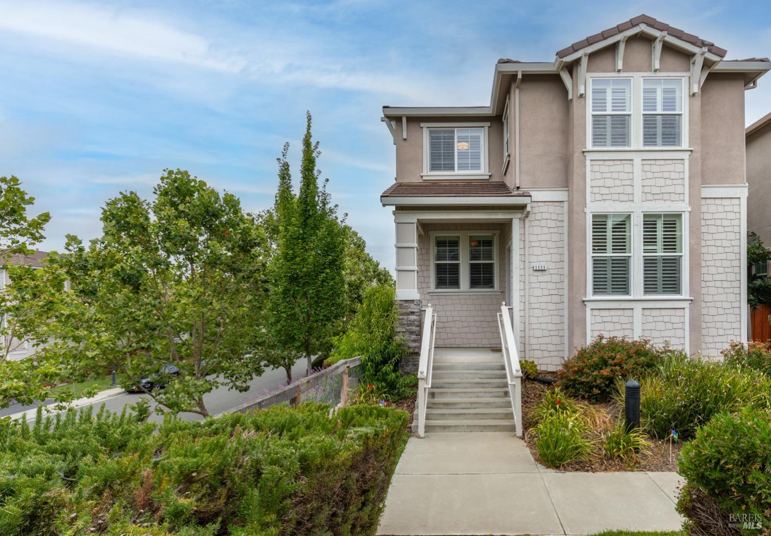 a front view of a house with garden