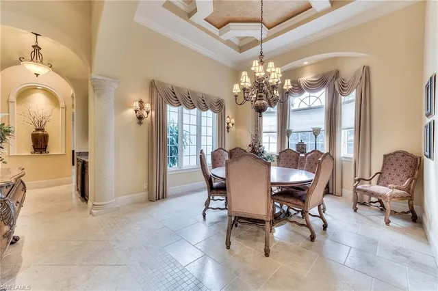 a view of hall way with wooden floor and cabinets