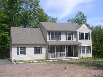 111-116 Grandview Road Cresco, PA 18326 - Photo 1 of 4 a front view of a house with a yard