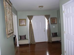 111-116 Grandview Road Cresco, PA 18326 - Photo 2 of 4 a view of a hallway with wooden floor and a livingroom with furniture