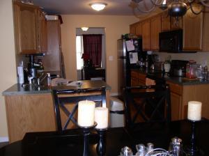 111-116 Grandview Road Cresco, PA 18326 - Photo 4 of 4 a kitchen with stainless steel appliances kitchen island granite countertop a stove a sink and a microwave
