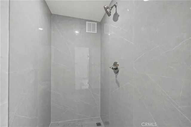 a view of an empty room and wooden floor