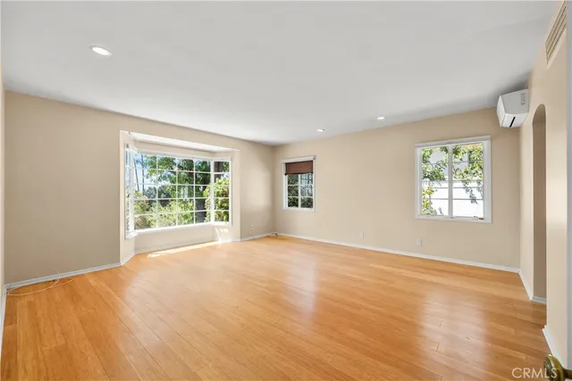 a bathroom with a granite countertop toilet sink and mirror