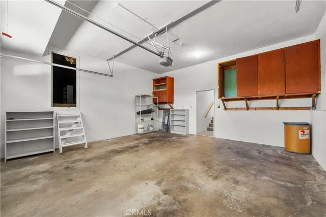 an aerial view of house with yard and seating space