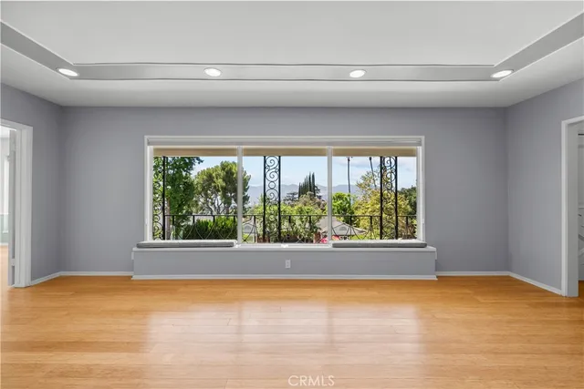 a view of a room with large windows