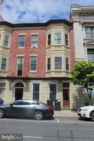 a front view of a house with parking space