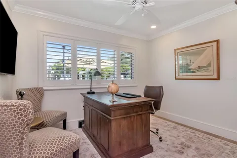 a bedroom with a large bed and a tv on dresser