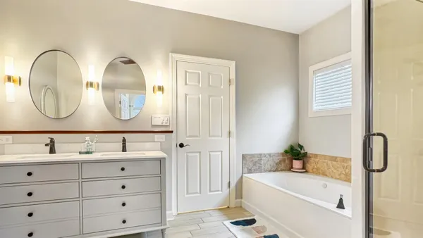 a kitchen with sink a stove and cabinets