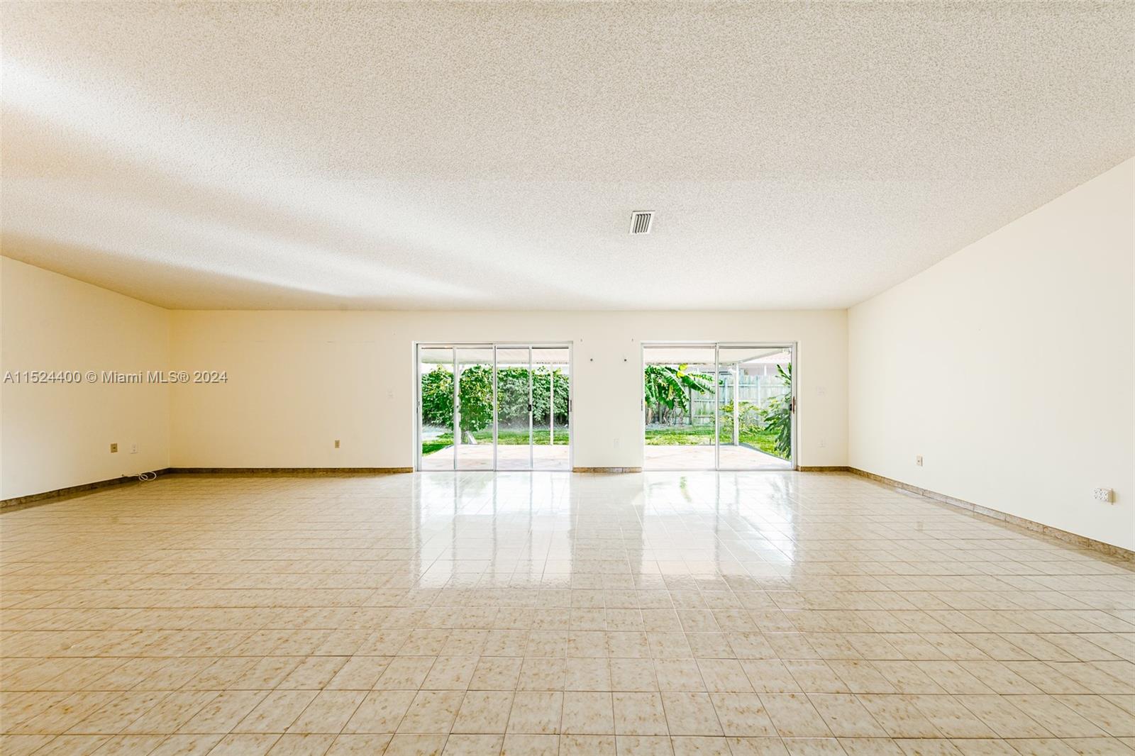10448 Southwest 23rd Street Miami, FL 33165 - Photo 11 of 35 an empty room with windows