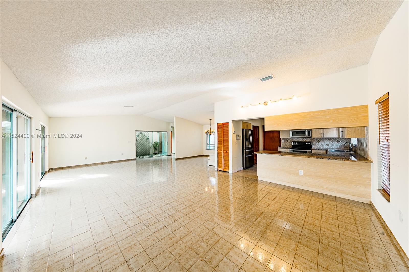 10448 Southwest 23rd Street Miami, FL 33165 - Photo 12 of 35 a view of a living room