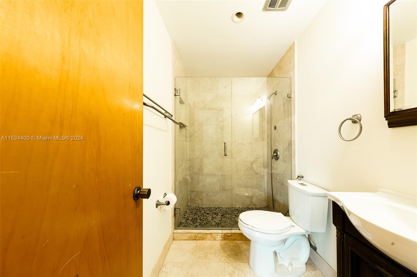 10448 Southwest 23rd Street Miami, FL 33165 - Photo 16 of 35 a bathroom with a sink toilet and shower