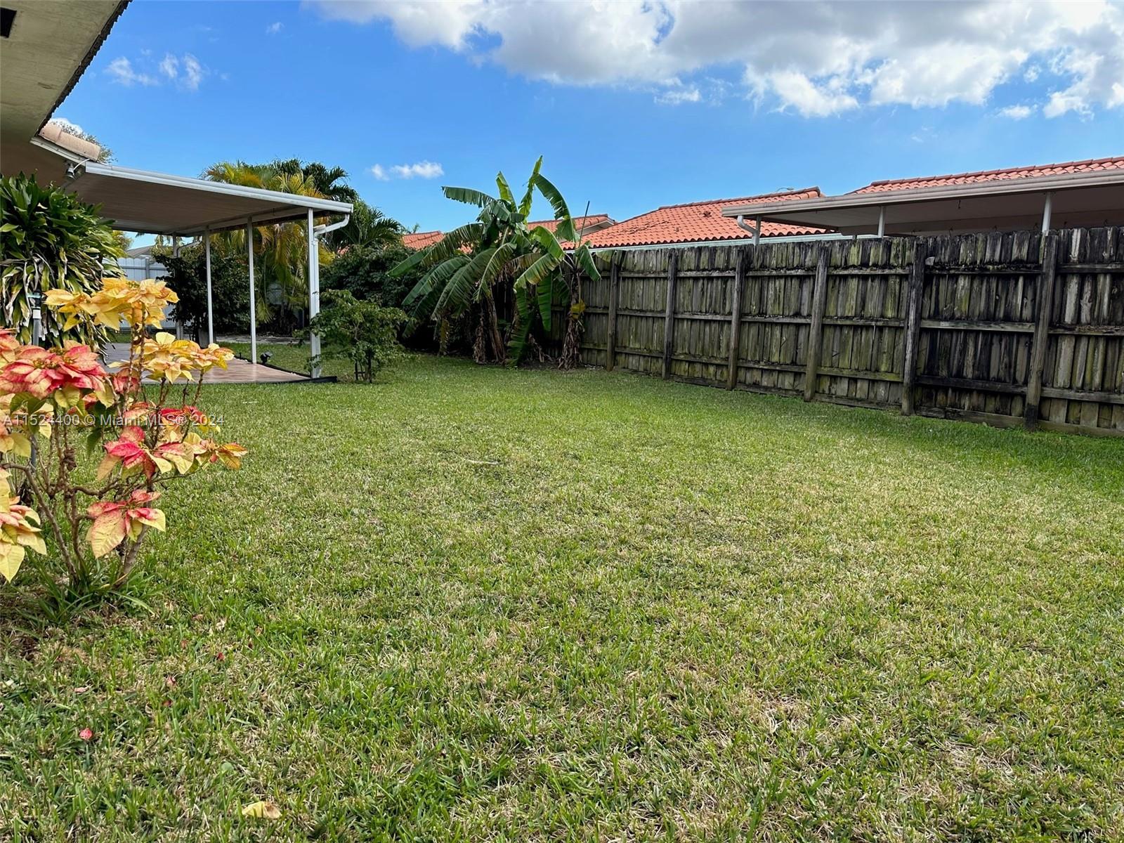 10448 Southwest 23rd Street Miami, FL 33165 - Photo 26 of 35 a view of a garden