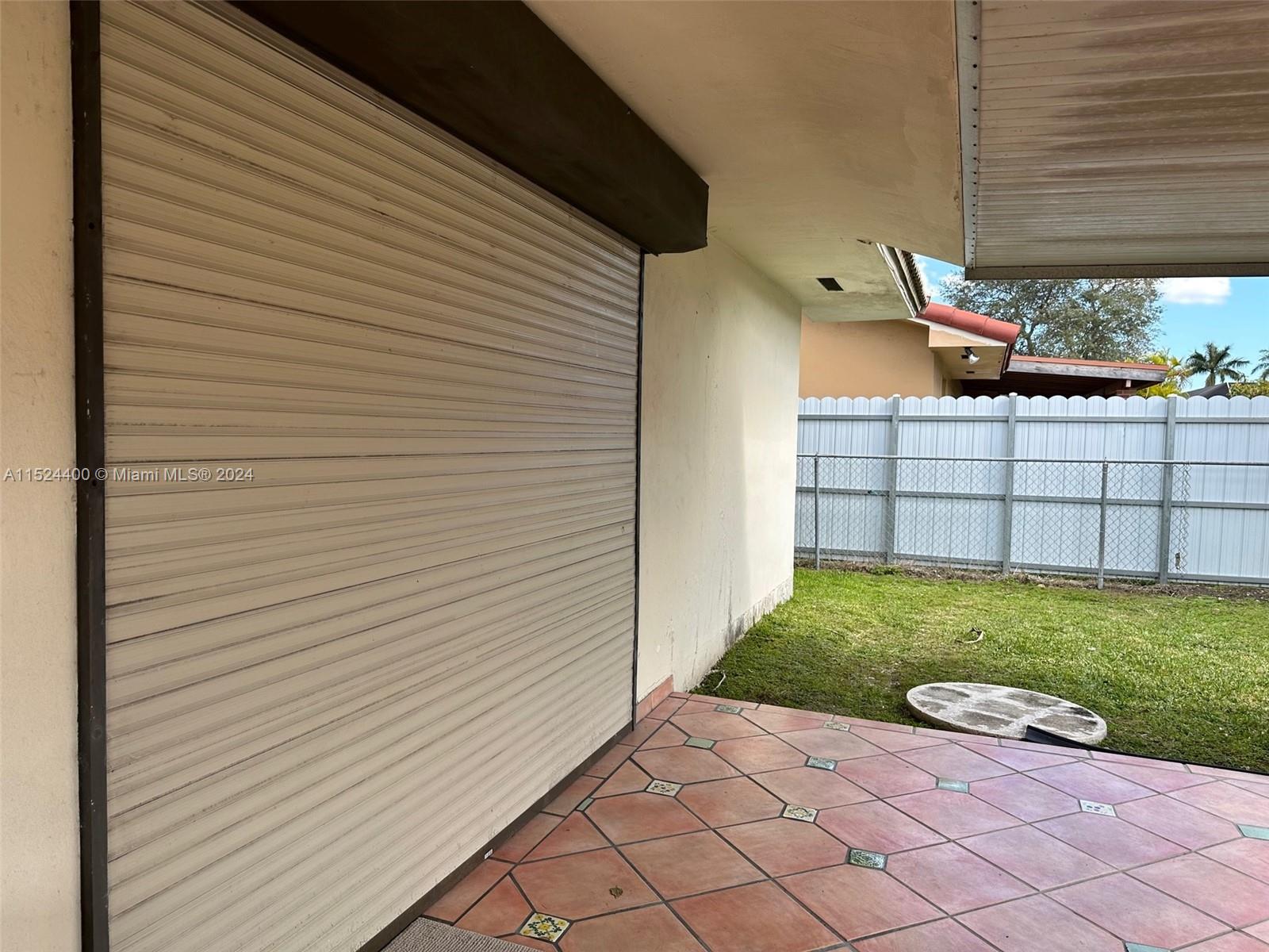 10448 Southwest 23rd Street Miami, FL 33165 - Photo 28 of 35 a view of a backyard