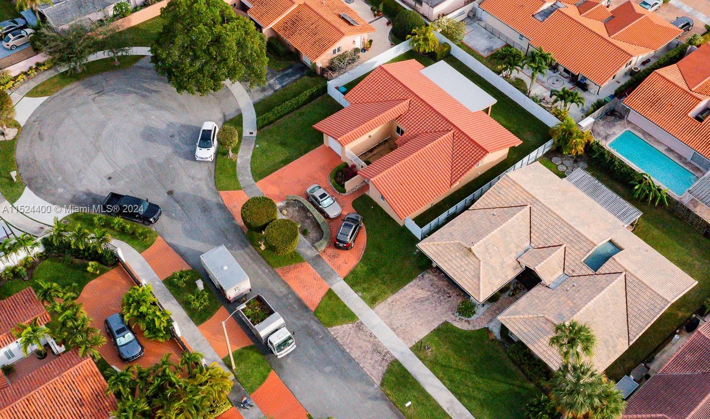 10448 Southwest 23rd Street Miami, FL 33165 - Photo 34 of 35 an aerial view of a house with a yard and outdoor seating