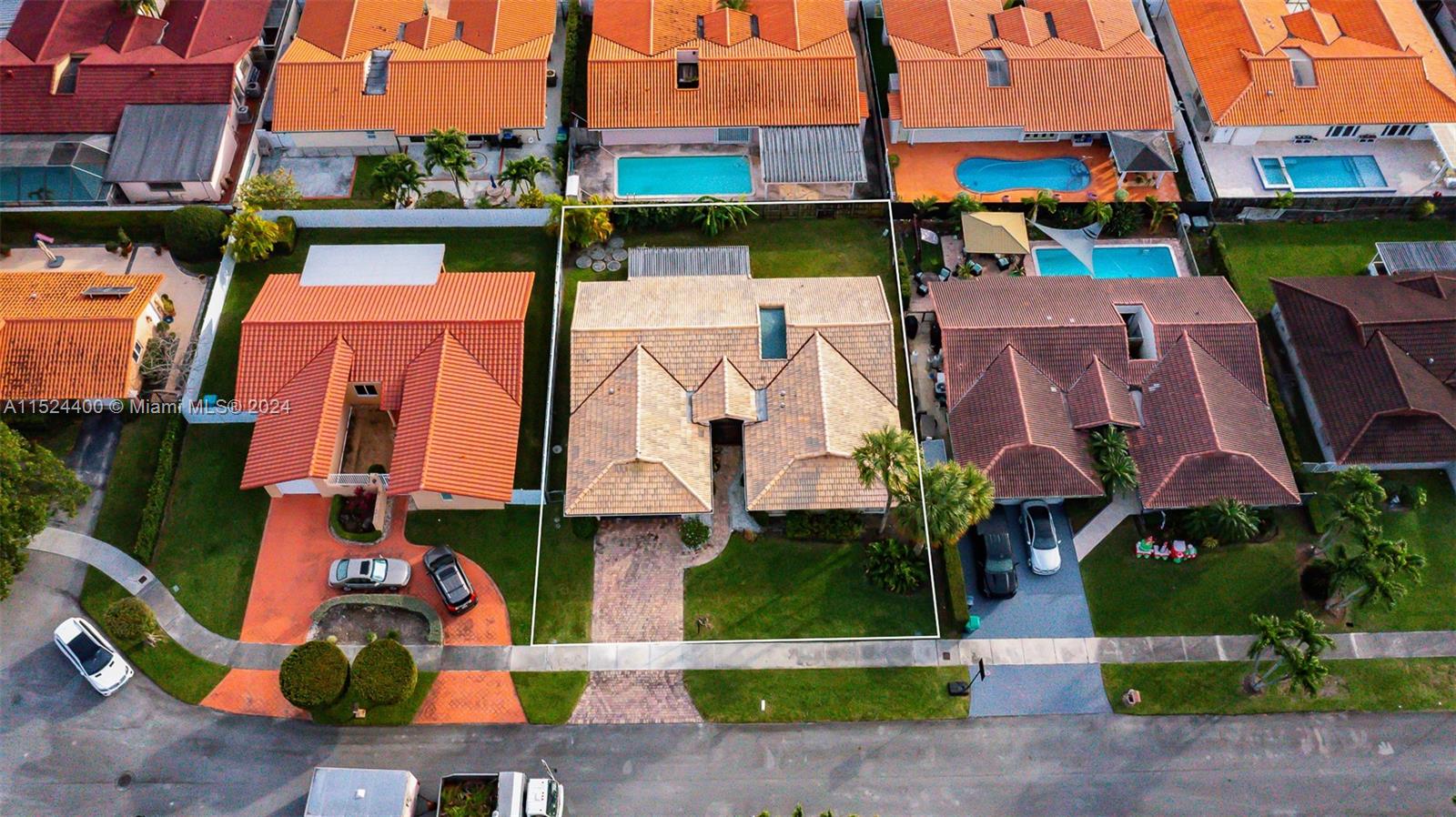 10448 Southwest 23rd Street Miami, FL 33165 - Photo 4 of 35 an aerial view of multiple houses with yard