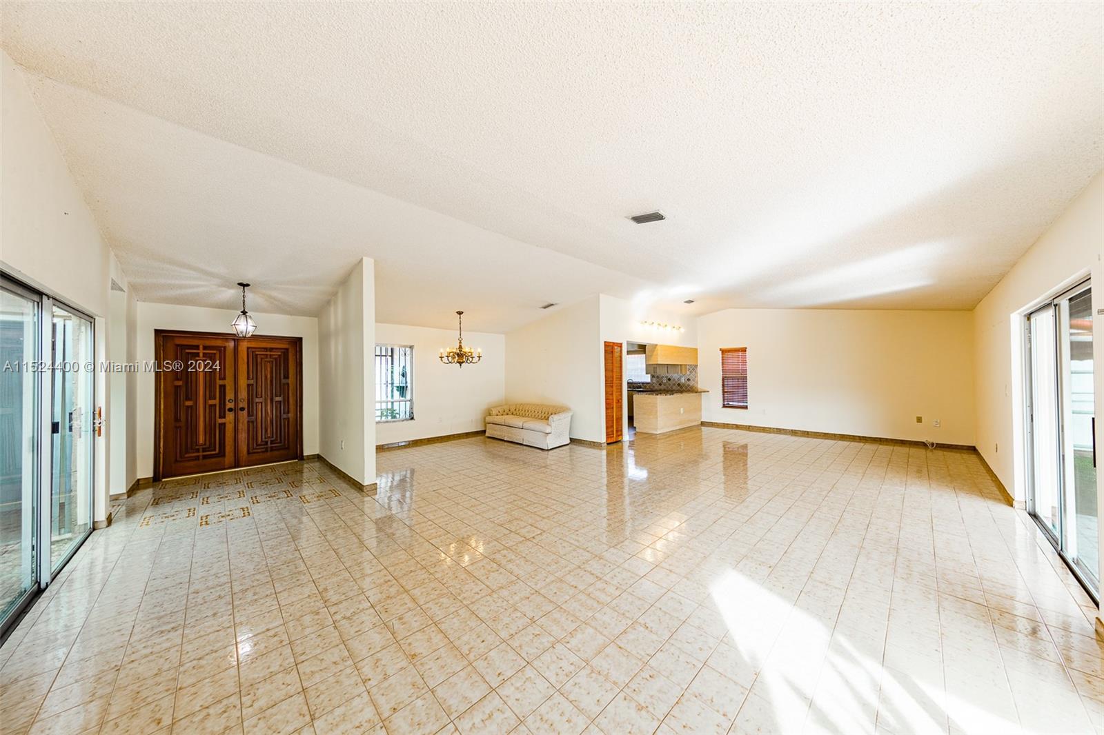 10448 Southwest 23rd Street Miami, FL 33165 - Photo 8 of 35 a view of empty room with wooden floor