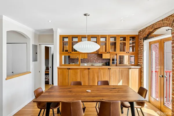 a dining room with a table and chairs