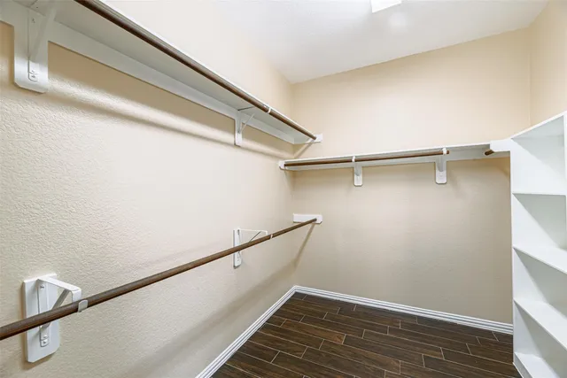 a view of a room with wooden floor