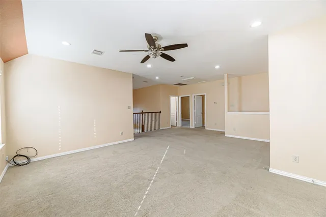 an empty room with a empty space and windows