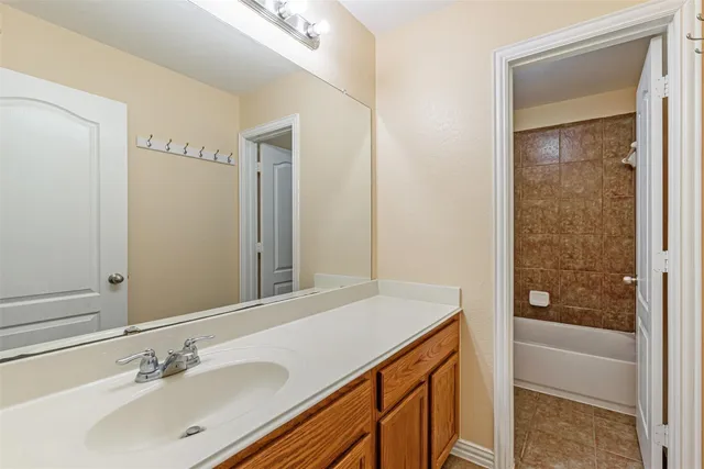 a bathroom with a bathtub and a sink
