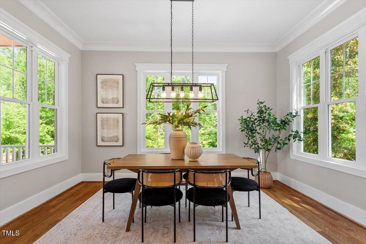 3932 Old Chapel Hill Road Durham, NC 27707 - Photo 21 of 46 a view of a dining room with furniture window and outside view