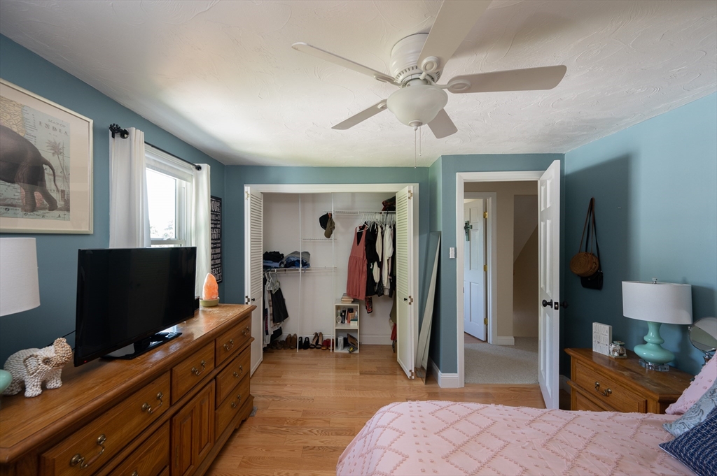 29 Wituwamat Road Weymouth, MA 02191 - Photo 28 of 42 a bedroom with furniture and a flat screen tv