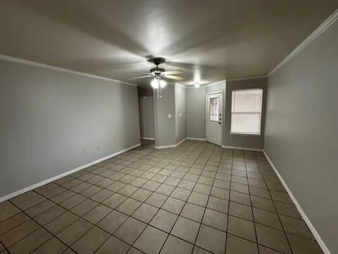 a view of an empty room and window
