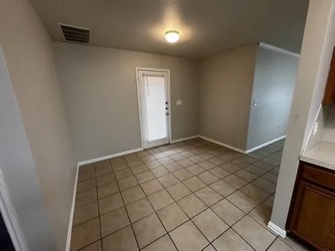 a view of an empty room and window