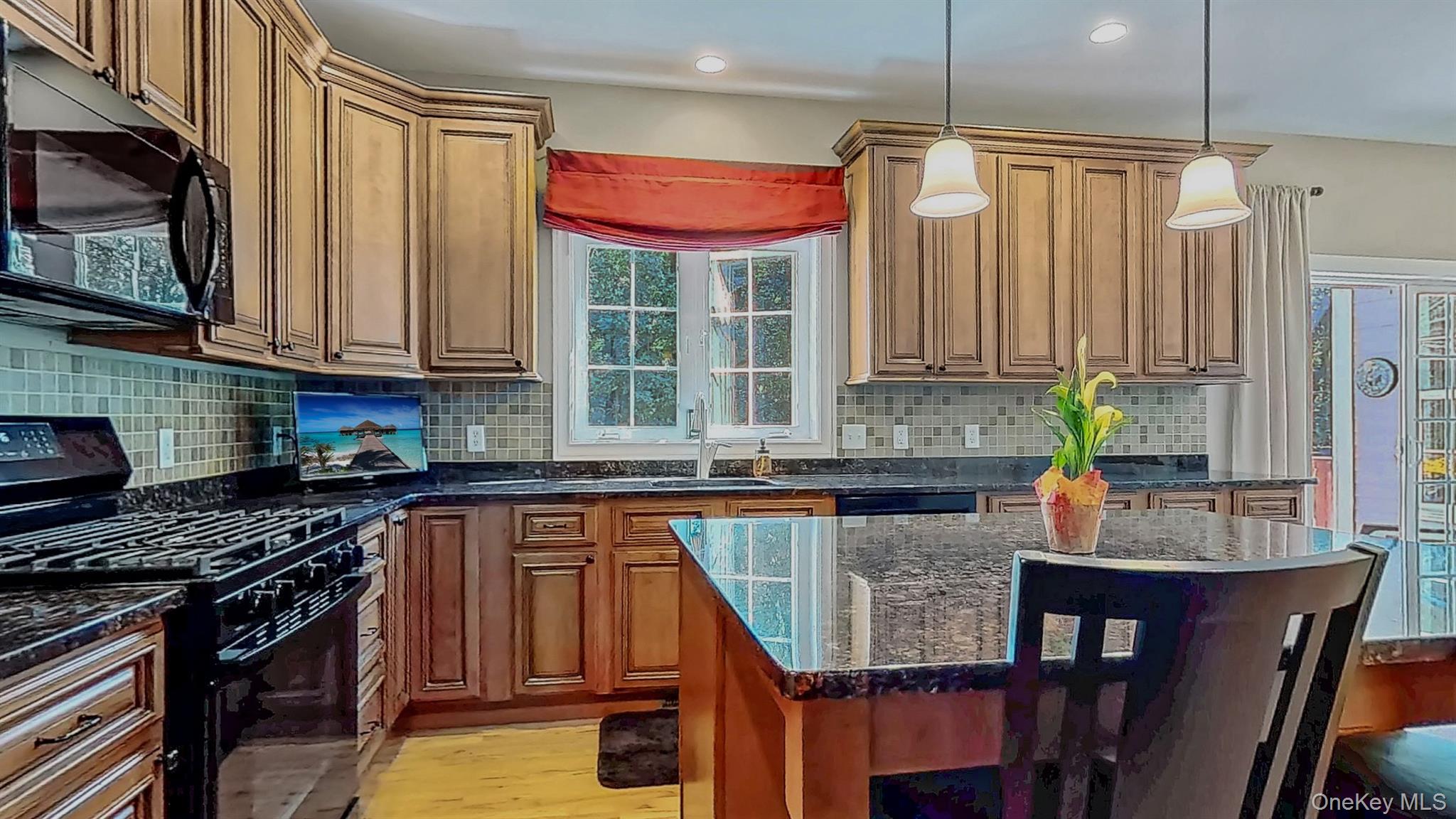 28 Madison Court Wallkill, NY 12589 - Photo 12 of 44 a kitchen with stainless steel appliances granite countertop a stove top oven a sink dishwasher and cabinets with wooden floor