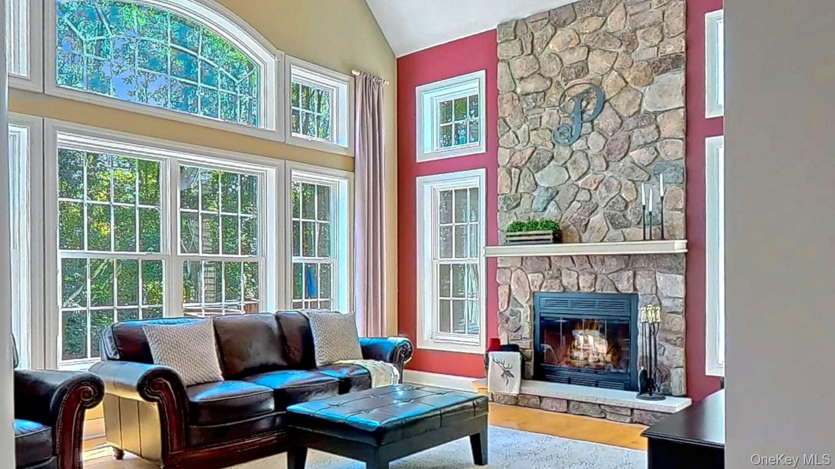 28 Madison Court Wallkill, NY 12589 - Photo 17 of 44 a living room with furniture a fireplace and a window