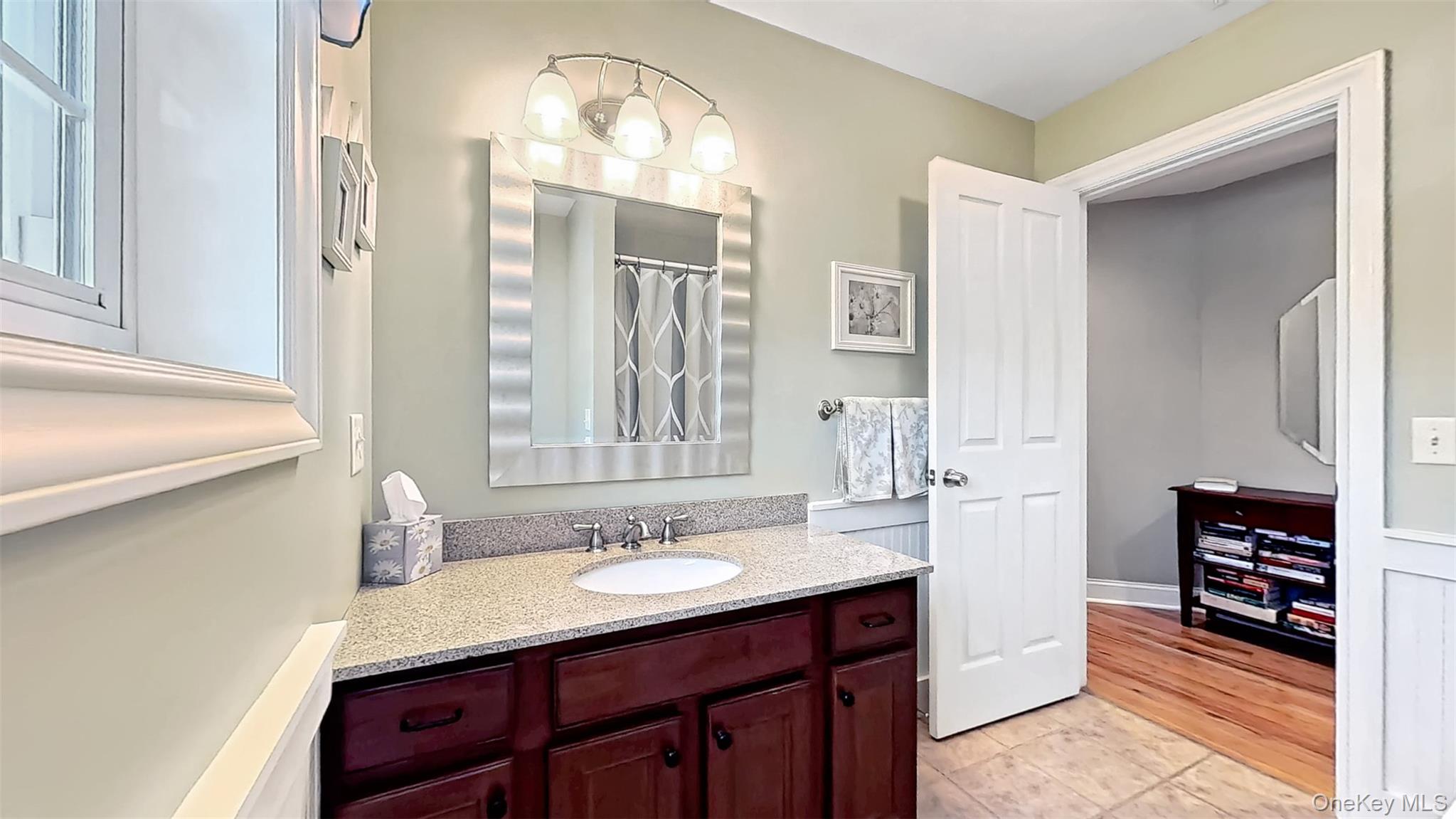 28 Madison Court Wallkill, NY 12589 - Photo 35 of 44 a bathroom with a sink double vanity and a mirror