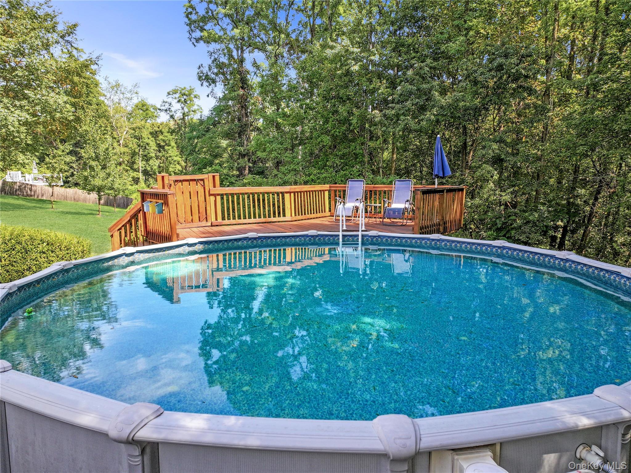 28 Madison Court Wallkill, NY 12589 - Photo 38 of 44 a view of a swimming pool with a patio