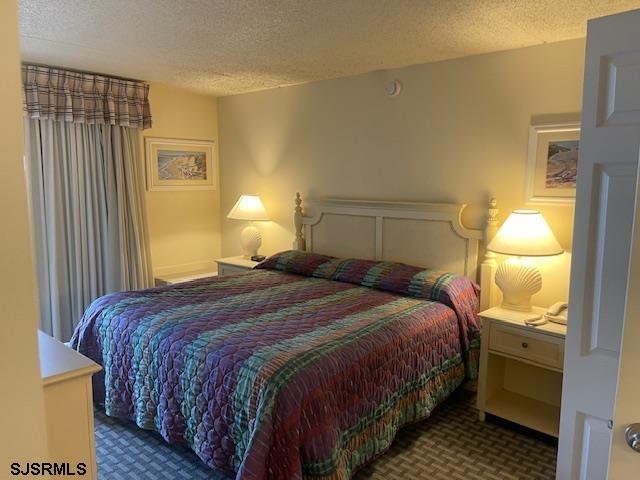 4500 West Brigantine Avenue, Unit 2216 Brigantine, NJ 08203 - Photo 11 of 14 a bedroom with a bed and lamps