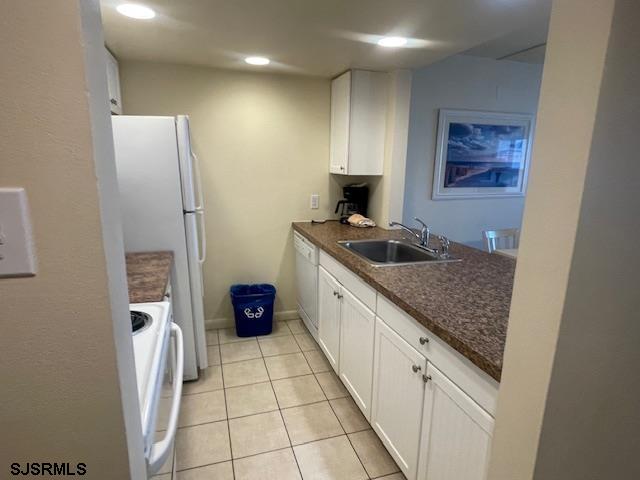 4500 West Brigantine Avenue, Unit 2216 Brigantine, NJ 08203 - Photo 2 of 14 a kitchen with stainless steel appliances granite countertop a refrigerator and a sink