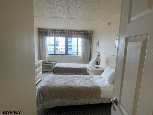 4500 West Brigantine Avenue, Unit 2216 Brigantine, NJ 08203 - Photo 9 of 14 a bedroom with a bed and window