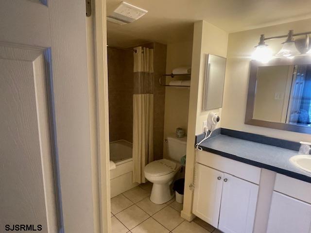 4500 West Brigantine Avenue, Unit 2216 Brigantine, NJ 08203 - Photo 10 of 14 a bathroom with a granite countertop sink a toilet a mirror and shower