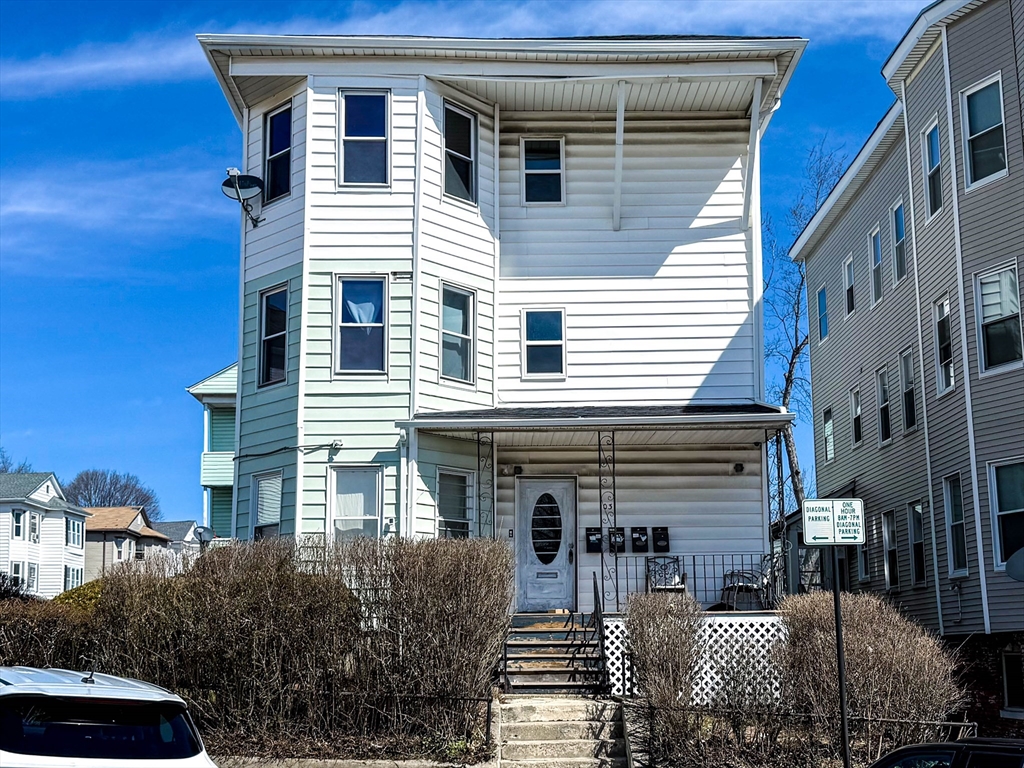 a view of a house with a yard and balcony